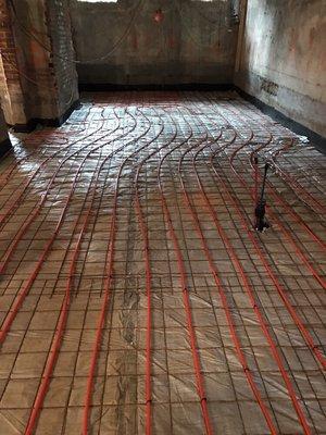 Radiant heat piping for a renovation in a basement. This set up is for a concrete floor