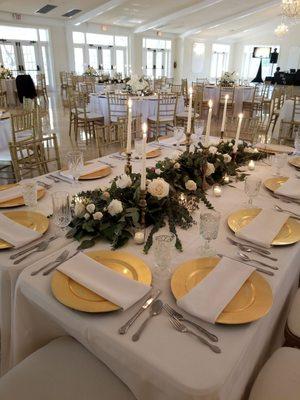 Large chandeliers with tables perfectly setup!