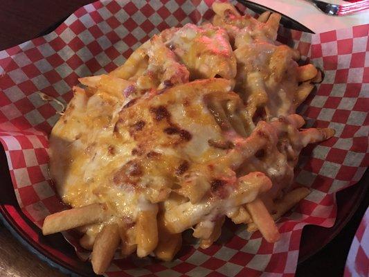 You see that, right? Bacon, melty cheese, ranch dressing and a three cheese blend, all smothering a large platter of fries.