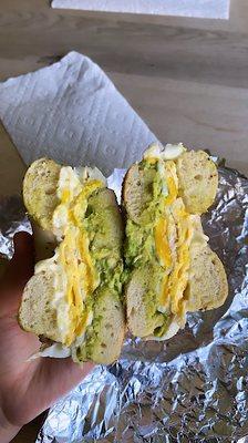 Egg cheese and avocado on an everything bagel