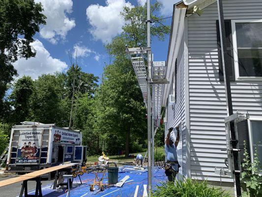 Scaffolding in driveway and work in progress