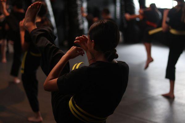 Our Juniors class (ages 8-12) practicing their front kicks.