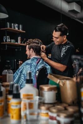 Barber Eddie with long hair cuts