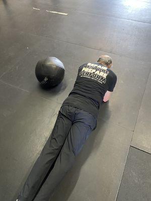 One of our senior patients working on his planks to improve longevity!