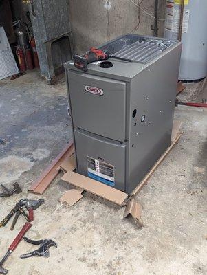 Here comes the new furnace. Note how the mess from removing the old furnace is already cleaned up.