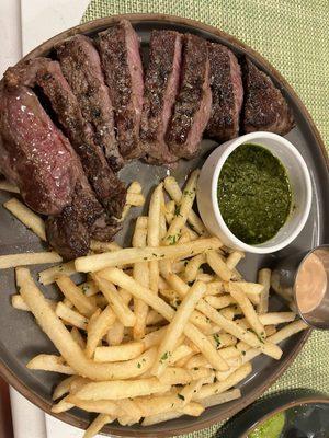 Steak with sauce and fries