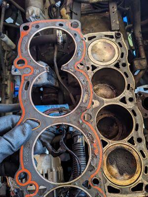 that red outline? the head gasket did not adhere because they did not clean the block, they also lost the dowels for the engine