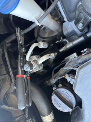 I took my car in for a coolant flush, and this clamp was left hidden toward the front of the engine compartment, easily missed.