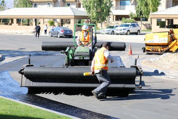 Laying petromat down.