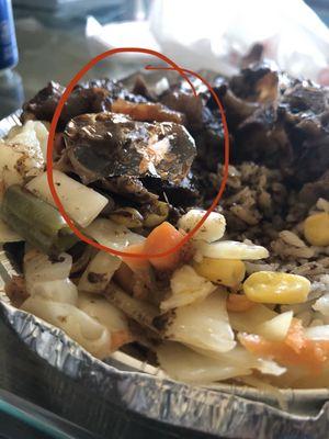 Oxtails, white rice and veggies plastics rapper in veggie