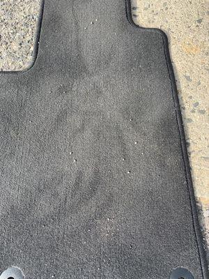 Dirty mats that I paid to have "washed"