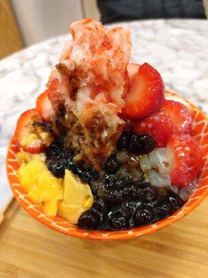 Strawberry shaved ice cream with pudding, tapioca, herbal jelly, lychee jelly (asian Jello-O), and condensed milk. SOOOO GOOD!!!