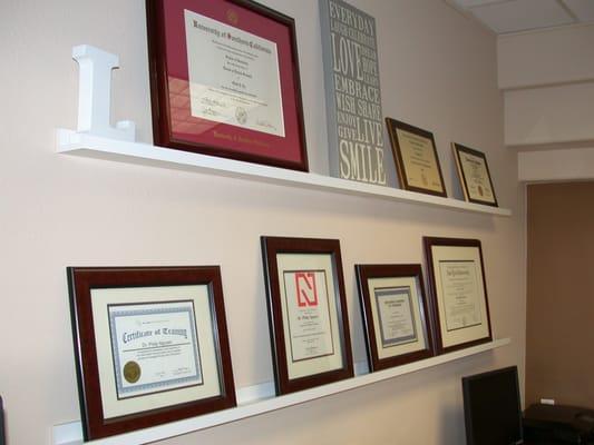 Diploma Wall. Dr. Ly graduated from USC & Dr. Nguyen graduated from NYU.