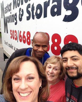 Happy Customers posing with one of our moving crews!