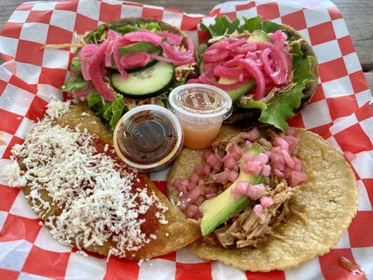 Clockwise: Panucho, salbute, conchita taco, chicken and veggie empanada.