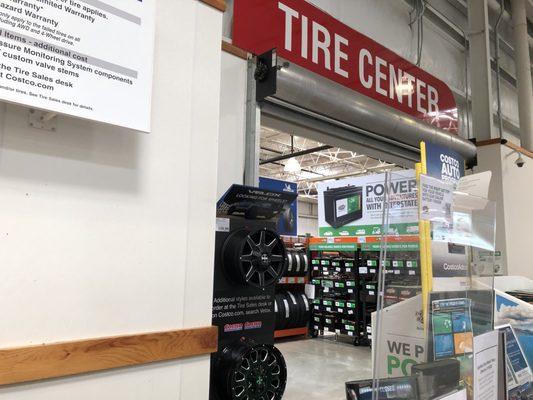 Tire center counter is inside the store between Customer Service and the food court.