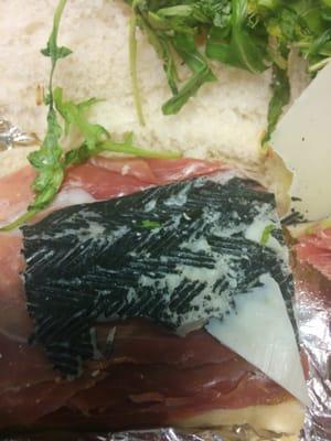 Rind from manchego cheese on sandwich from Devon & Blakely.