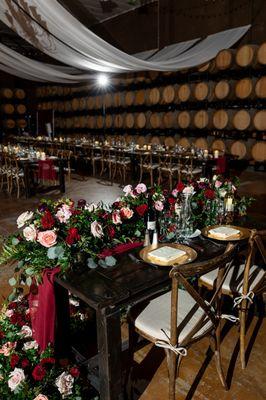 Our sweetheart table with flowers repurposed from the ceremony site