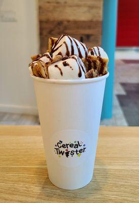 Cereal Hot Chocolate topped with marshmallows, chocolate syrup and Cinnamon Toast Crunch