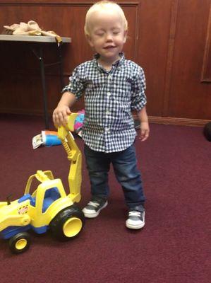 Spencer showing off a "truck! truck!" during a monitored visit at The Ness Counseling Center.