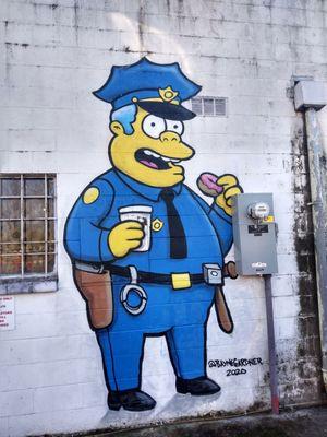 The Simpsons murals:  440 Main Street (Alley) Chief Wiggum - "Uh, no you've got the wrong number. This is 9-1... 2"