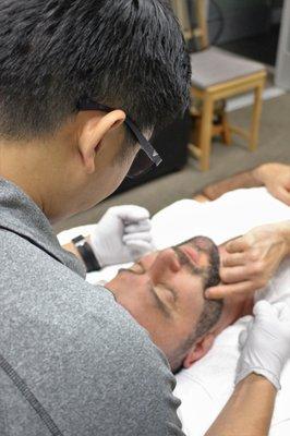 Dr. Lin treating TMJ using craniosacral techniques!