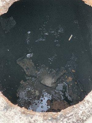 Solids in the bottom of the septic after he supposedly pumped out everything