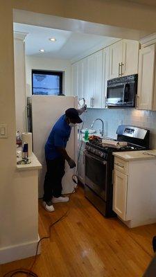 Michael and T hard at work behind the fridge