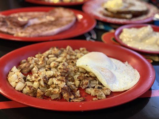 2 Eggs, Potatoes, Ham Steak, and Biscuits and Gravy.