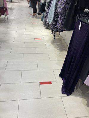 Social distancing markers placed throughout the store