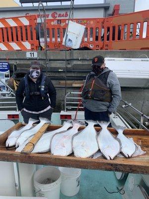 Two people and the halibut they caught