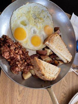 Corned beef hash with 3 eggs, sourdough, and country potatoes $15