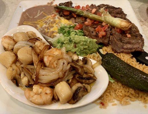 Carne Asada with sautéed shrimp and scallops was really good