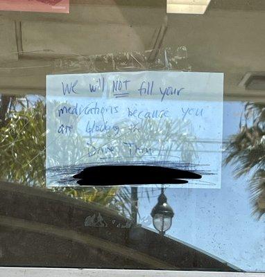 Note on window with my name blacked out.