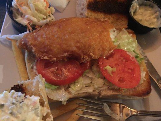 Tiny piece of hard & dry fish in a gigantic burnt ciabata roll. That is the bottom half of the roll the burnt top is above.