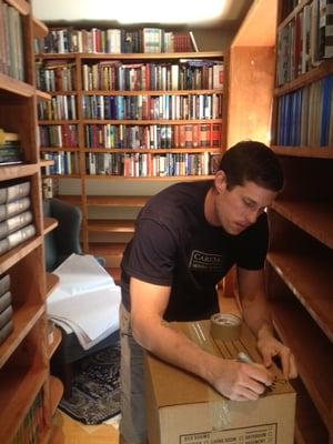 Jameson packing one of 400+ book boxes.  This home library in Mill Valley had 14,000 books.