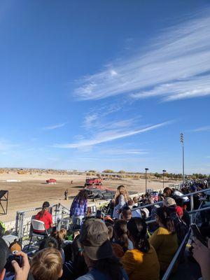 Phones out in the stands filming the monster trucks show