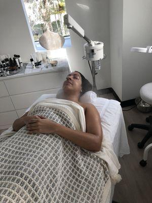 Our contest winner enjoying her Dermaplaning Facial. :)