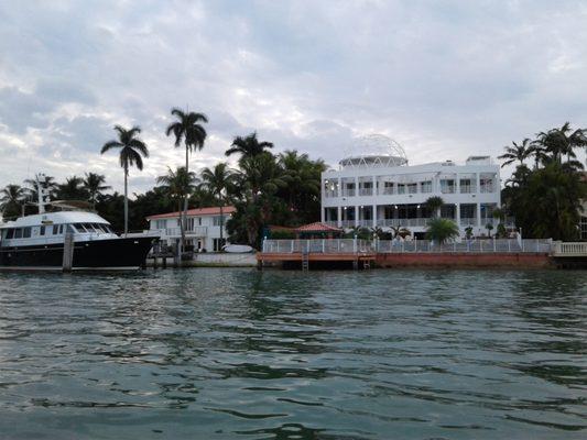 House used in Miami Vice TV show. At nigh the house is lit up blue or purple and the geodome changes colors.  Wish I could see it.