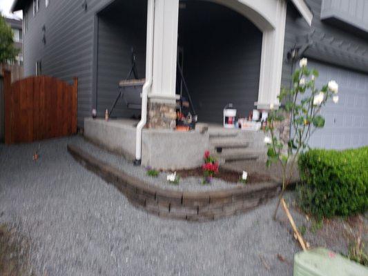 Hardscaped and cleaned up shrubs.