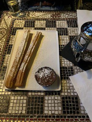 Churros and love the chess table with the pieces in a little drawer underneath