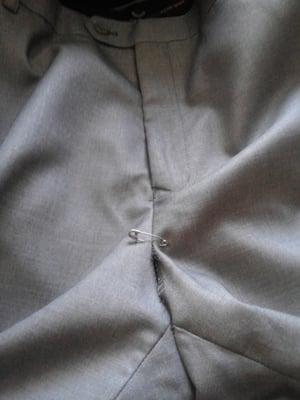 This is what Parkwoods Cleaners calls fixing a rip. They just put a safety pin on the pants. They did not fix anything.