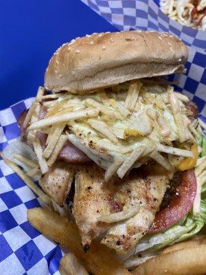 La Callejera beef patty, chicken breast, pork chop, bacon, fried egg & ham, lettuce, tomatoes, onions, cheddar cheese, potato sticks