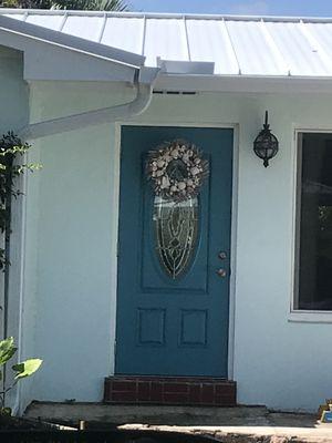 Front door and downspout.