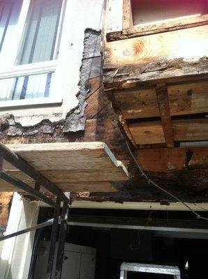 termite/dryrot deck leakage behind  stucoo in avenue house