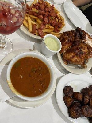 Pollo, Maduros, rice and beans, sangria, salchipapas.