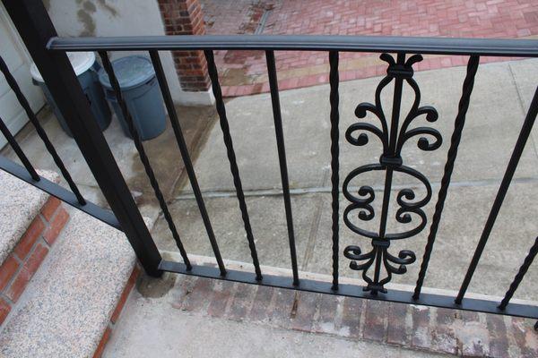 Primed and painted with flat black oil based enamel paint.  Prior railings lasted over 50+ years but was quite dated and showing it's age.