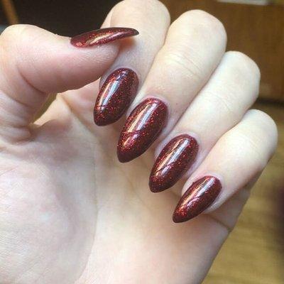 Glittery blood red stiletto gel nails