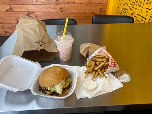 Double cheeseburger. Strawberry shake, fries, side of blue cheese