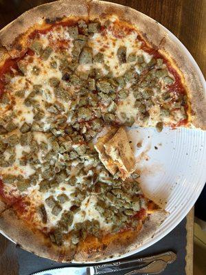 Meatball pizza. The pieces of meatball were cut up and resembled tiny pencil erasers.